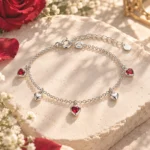 Pulsera Corazones Rojos de plata 925 con dijes de corazones rojos y plateados sobre piedra natural, colección LOVE de Glow Secret.
