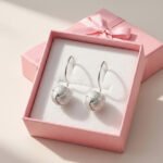 aros colgantes esferas auroras en caja de joyería rosa estilo regalo