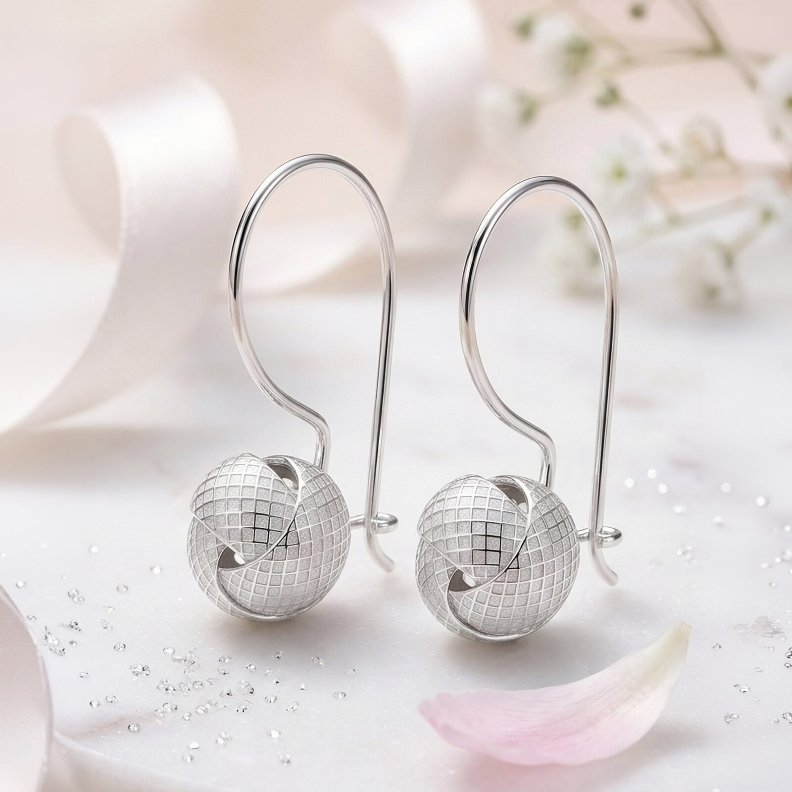 aros colgantes esferas auroras en escena elegante de joyería femenina